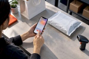 Hands verifying an ecommerce test purchase